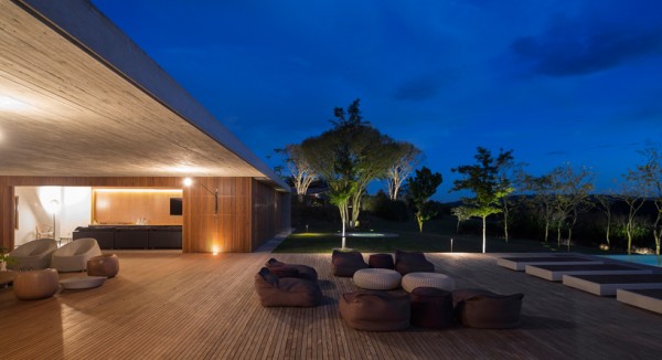 Open-air patio at night. Image via Studio MK27.