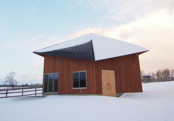 Through heat exchangers and passive design elements, the Barn House, manages to stay warm for man and beast in the winter. Image via co+labo.