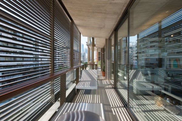 A closeup view of the wooden louvers on the apartment balconies. Image by Nigel Young via Faena Group.