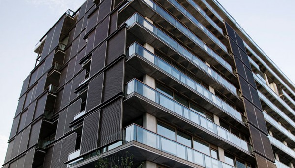 The Aleph Residences in Buenos Aires, Argentina, showing sliding wooden panels to control solar gain. Image via Faena Group.