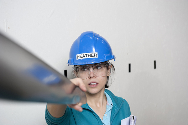 A female engineer constructing a 1:50-scale model turbine that was tested in the Netherlands. (image via DeepCWind/Flickr)