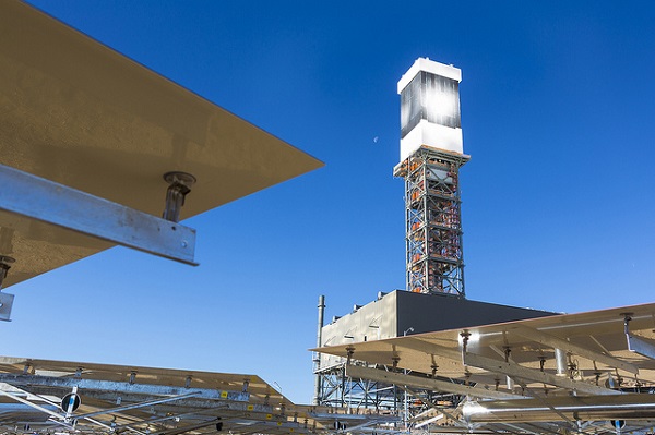 The top of Tower 1 is "lit" during a steam blow test. (image via BrightSource Energy)