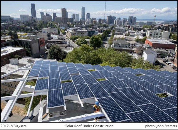 A view of the Seattle skyline from the roof-mounted solar array. Image via Bullitt Foundation.