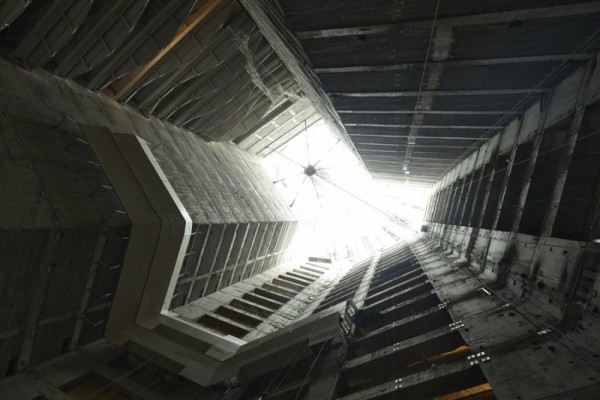 A vertical view up through the central atrium during constructions shows how natural light will be drawn into the interior. Image via SOM.