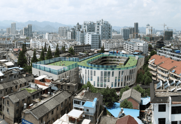 The winning proposal for China's ChiCheng Second Primary School calls for a rooftop natural grass running track. Image via LYCS Architecture.