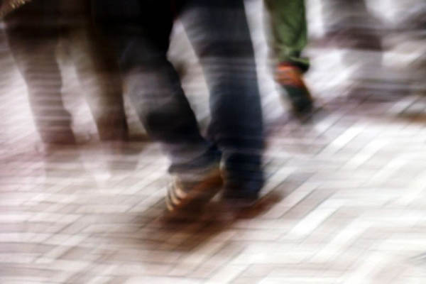 blurry-feet-walking-sidewalk