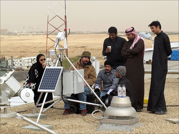 Mike Dooraghi works with engineers from K.A.CARE to install a rotating shadowband radiometer at the Al-Uyaynah Research Station near Riyadh. (image credit: Steve Wilcox/NREL)